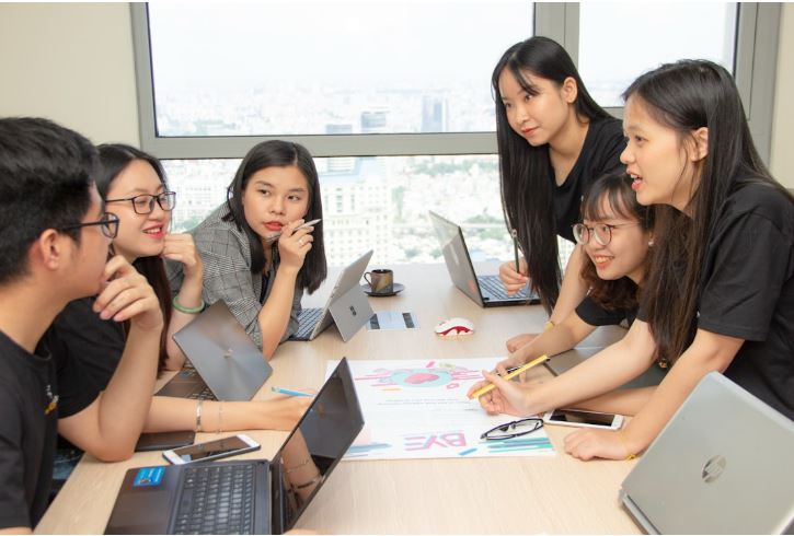 A group of professionals utilizing AI connectivity to enhance collaboration and increase efficiency