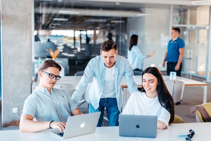 Professionals collaborating using AI-powered tools for efficient communication and project management